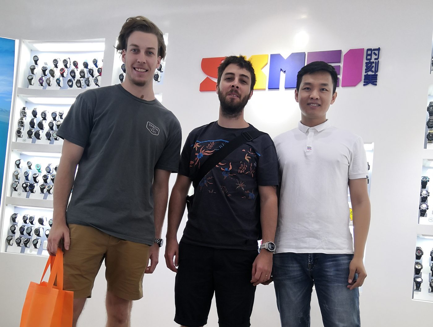 Overseas buyers with a SKMEI export team member in the showroom, 2019