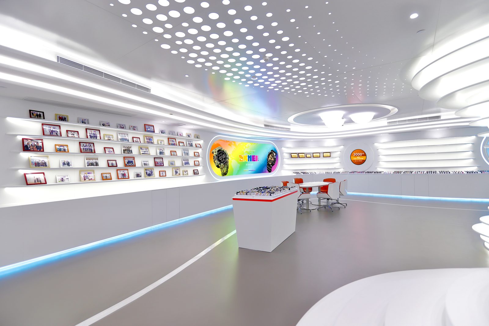 Showroom wall with framed customer and exhibition photographs