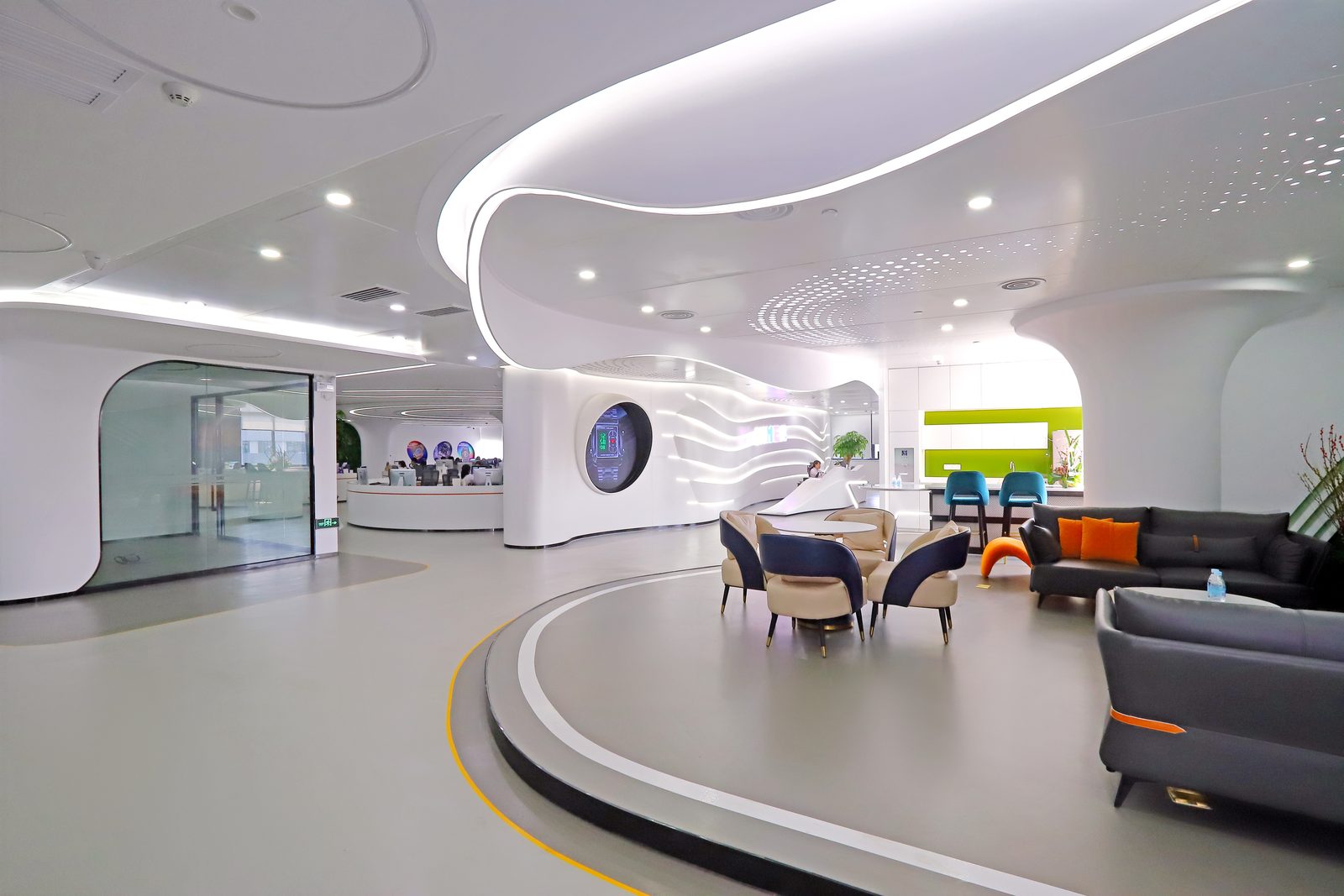 Factory staff lounge with seating pods and green wall